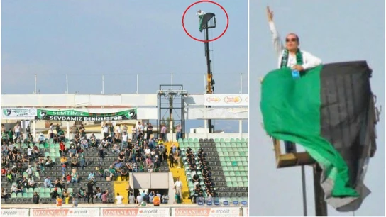 Aficionado sigue el partido desde una grúa Aficionado sigue el partido desde una grúa