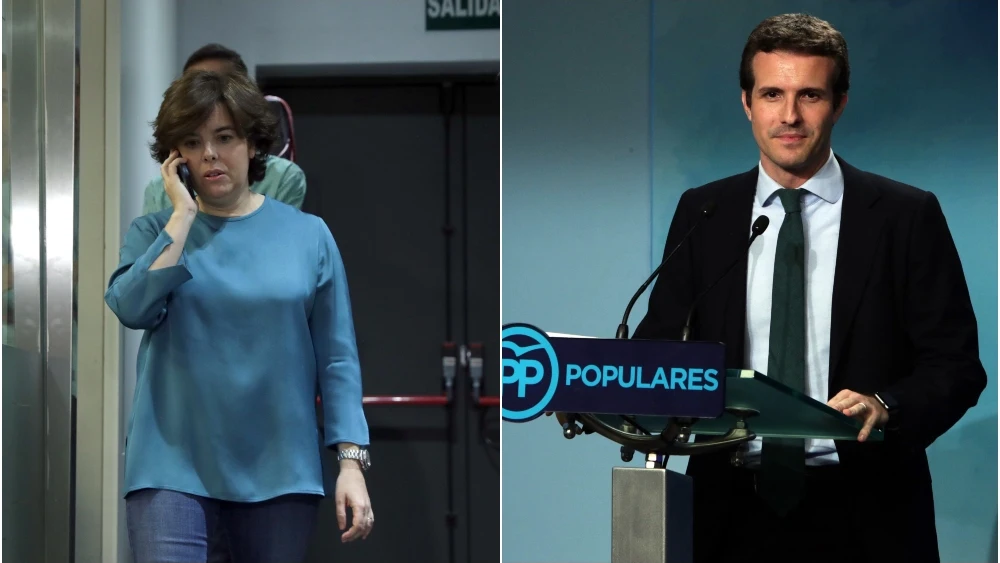 A la izquierda de la imagen, Soraya Sáenz de Santamaría; a la derecha, Pablo Casado