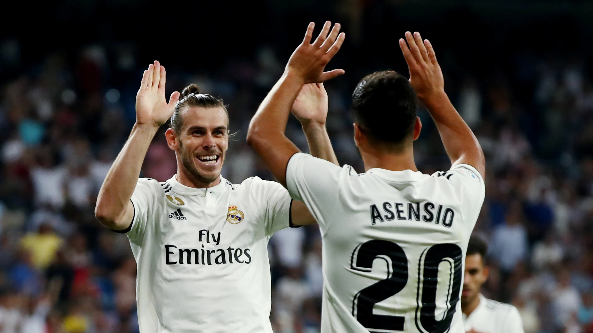 Asensio celebra con Bale el gol del galés ante el Getafe