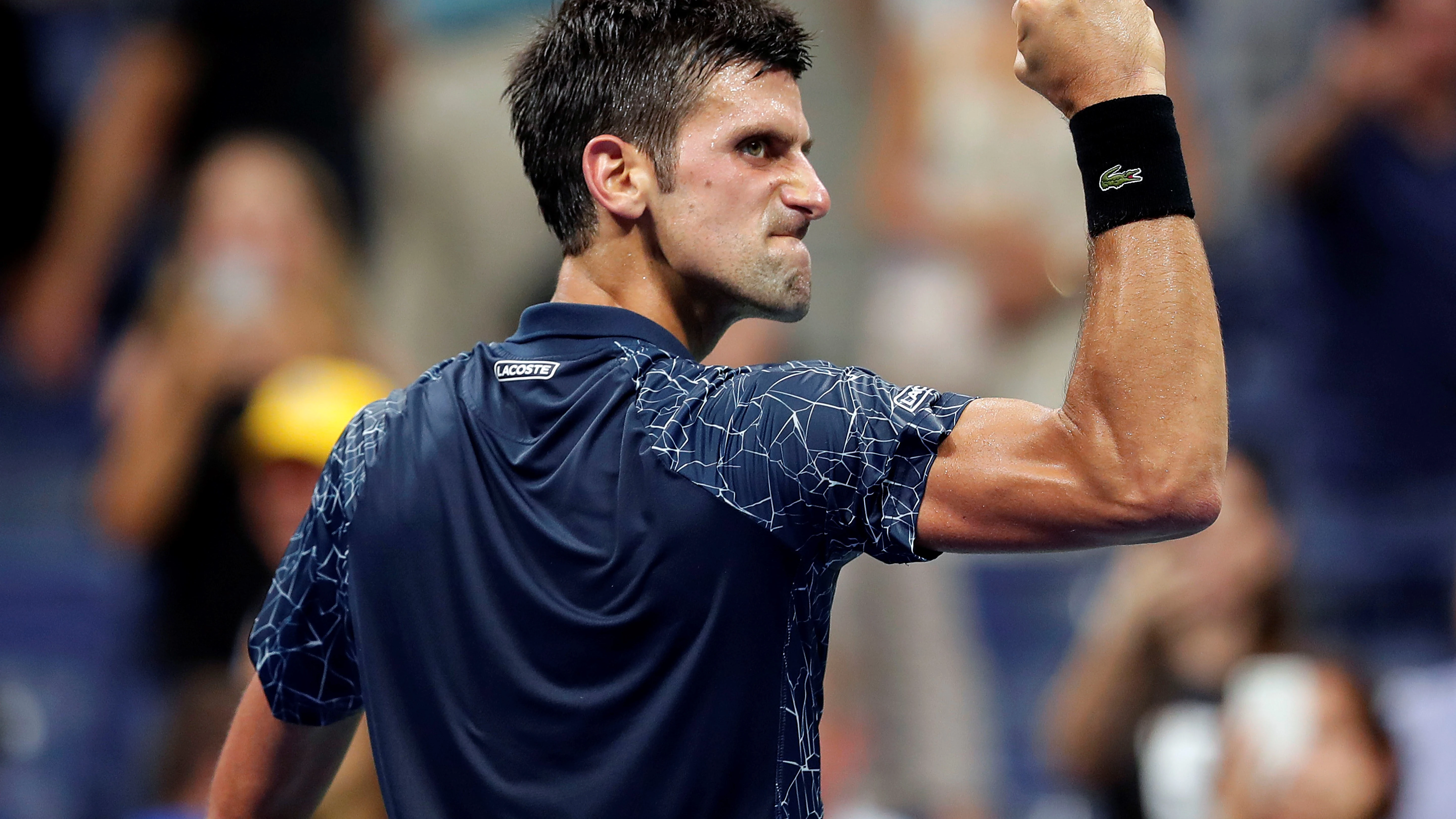 Djokovic celebra un punto contra Millman