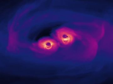 La increíble simulación de la unión de dos agujeros negros supermasivos en el universo