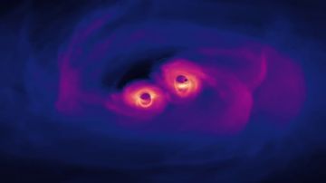 La increíble simulación de la unión de dos agujeros negros supermasivos en el universo