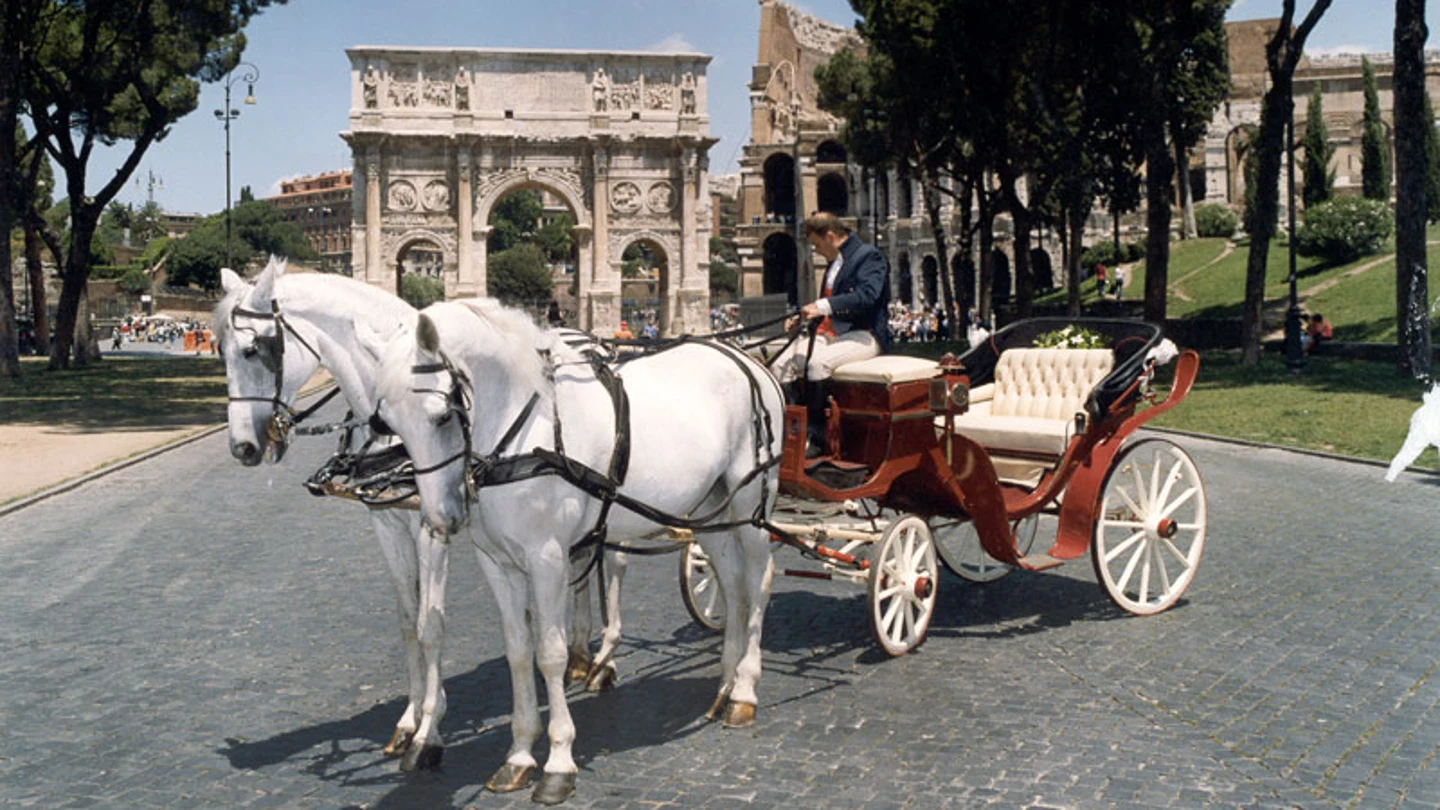 Un carruaje de caballos en Roma Un carruaje de caballos en Roma