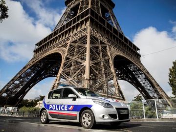 A teenager dies after crashing his motorcycle into a police car near Paris
