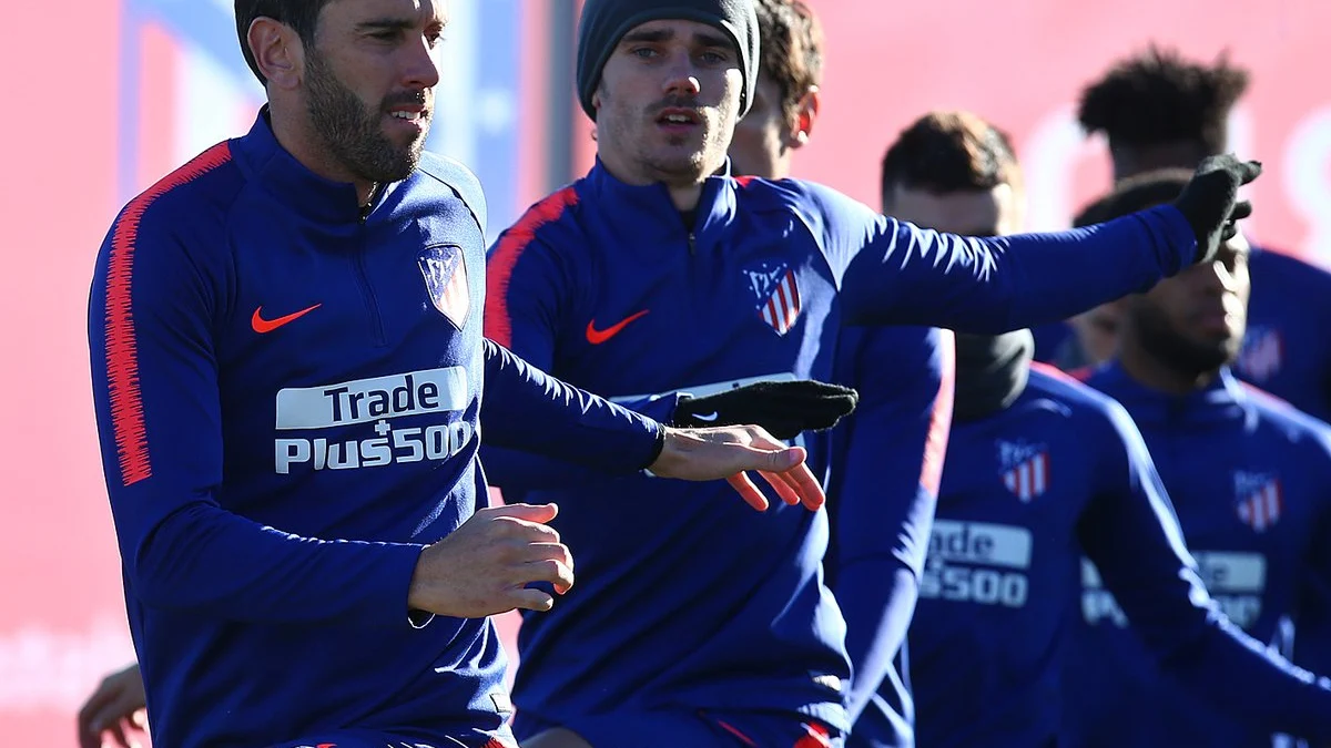 Godín y Griezmann, en un entrenamiento