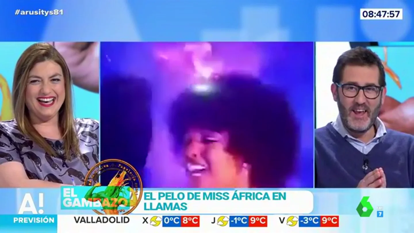 El pelo de Miss África ardiendo El pelo de Miss África ardiendo