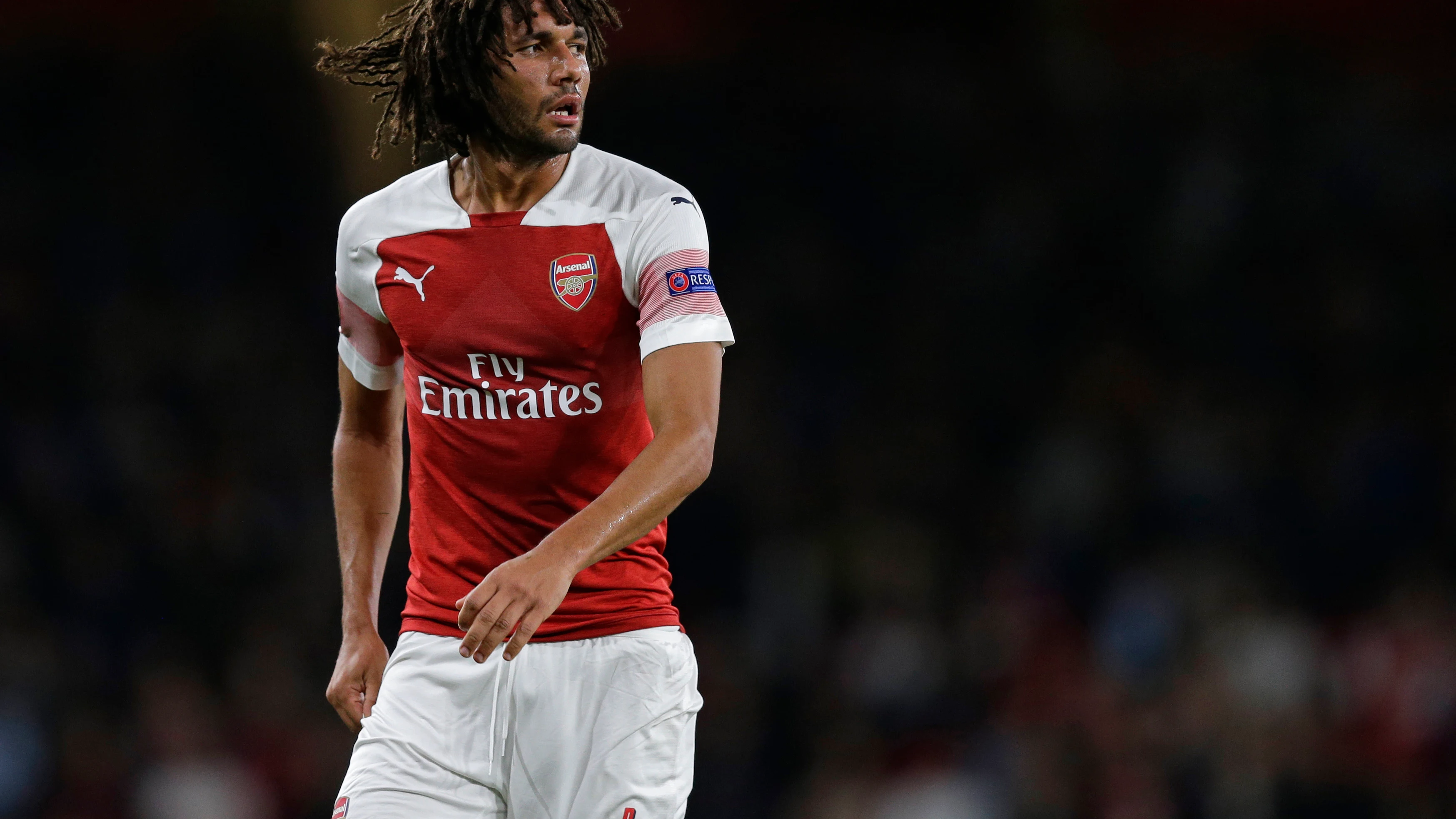 Mohamed Elneny, disputando un partido con el Arsenal