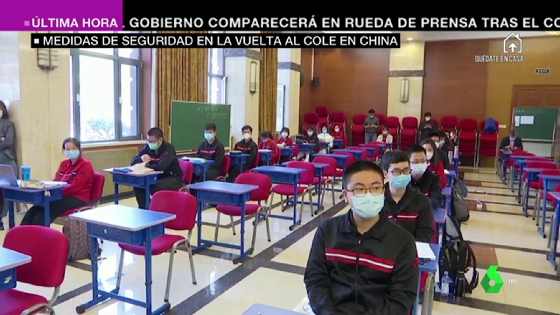 Con controles de temperatura y pantallas protectoras: las imágenes de la vuelta al colegio en China