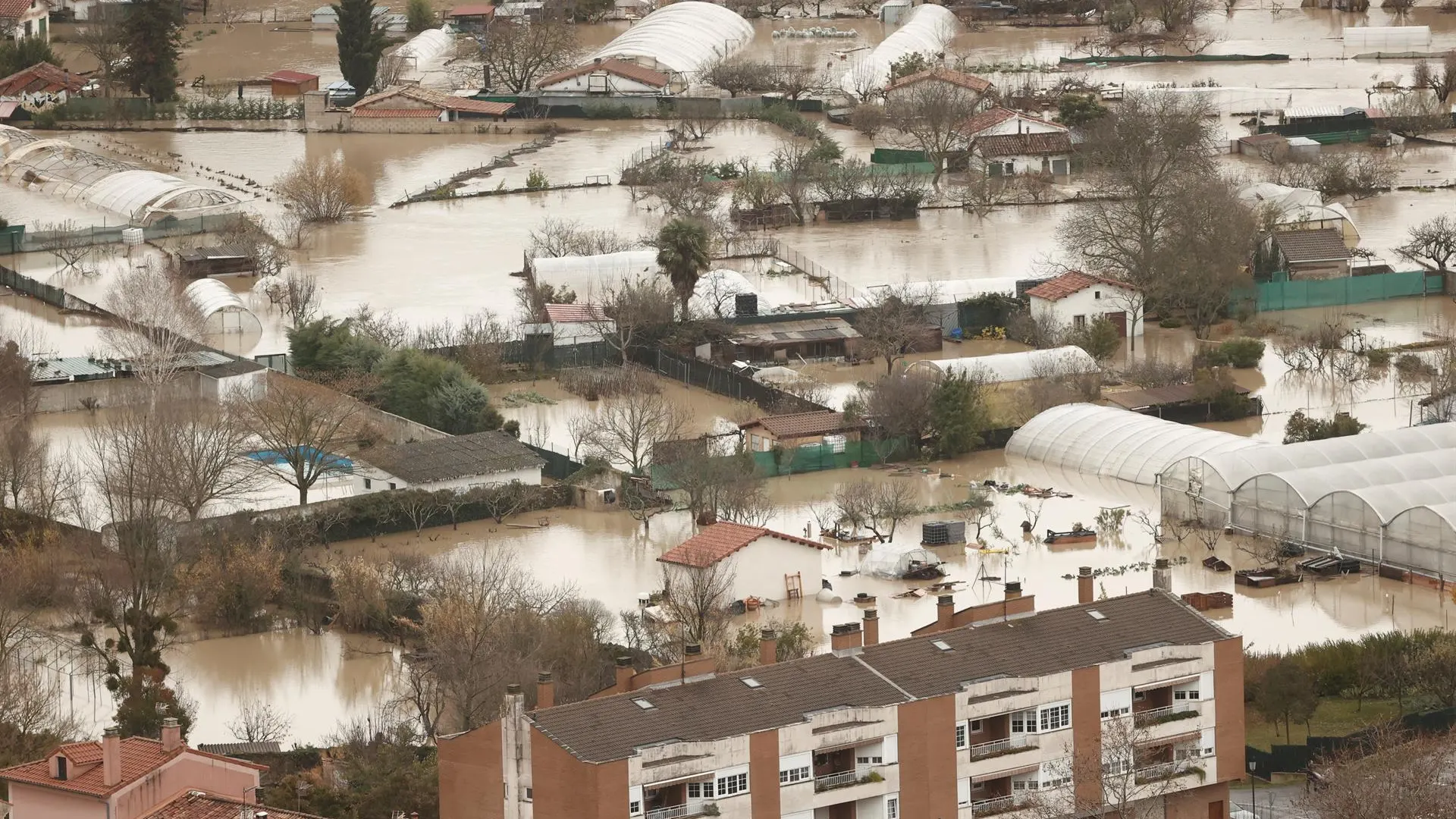 Vista aérea de las huertas tras las inundaciones ocasionadas por el desbordamiento río Arga a su paso por Huarte en Navarra