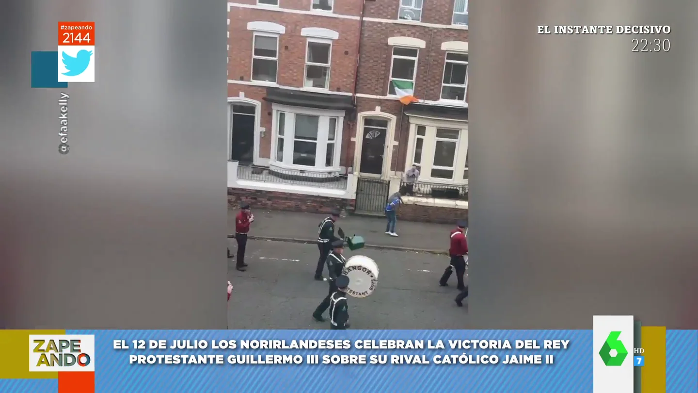 Un irlandes tira un cubo de basura durante la fiesta nacional Un irlandes tira un cubo de basura durante la fiesta nacional