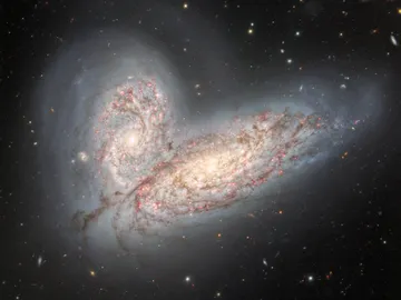 Fusión de las galaxias NGC 4567 y NGC 4568 Fusión de las galaxias NGC 4567 y NGC 4568