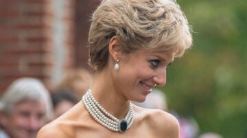 Close-up of Elizabeth Debicki wearing the low-cut black dress with which Lady Di skipped protocol.