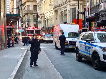 The collapse of a parking lot in Manhattan buries several people and leaves at least one dead