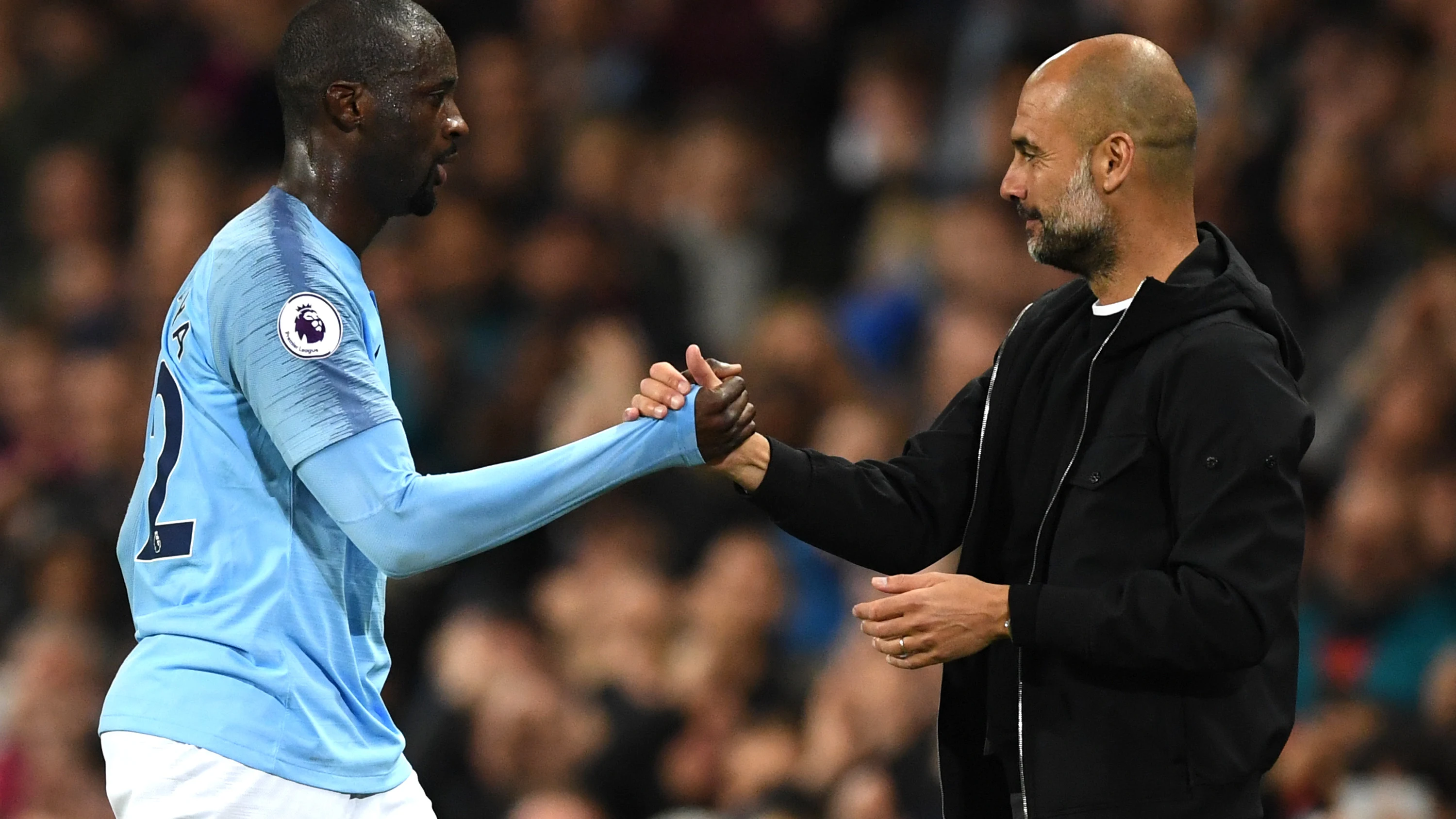 Touré Yaya y Pep Guardiola