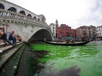 The water of the Grand Canal in Venice is dyed a mysterious fluorescent green