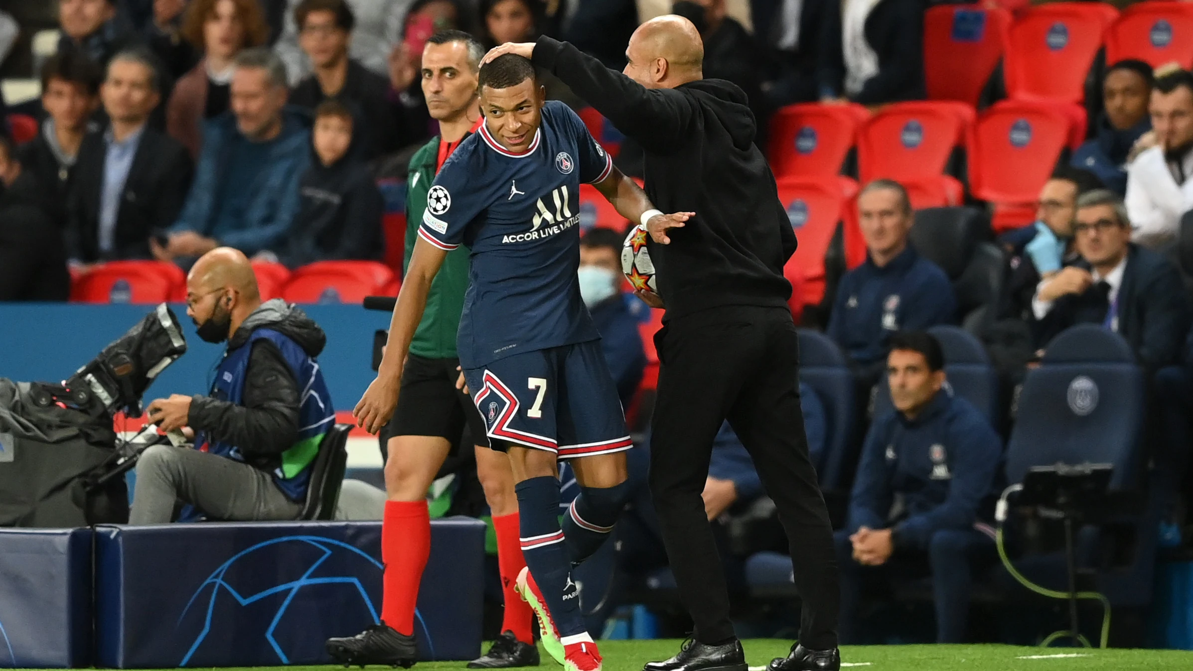 Pep Guardiola y Kylian Mbappé