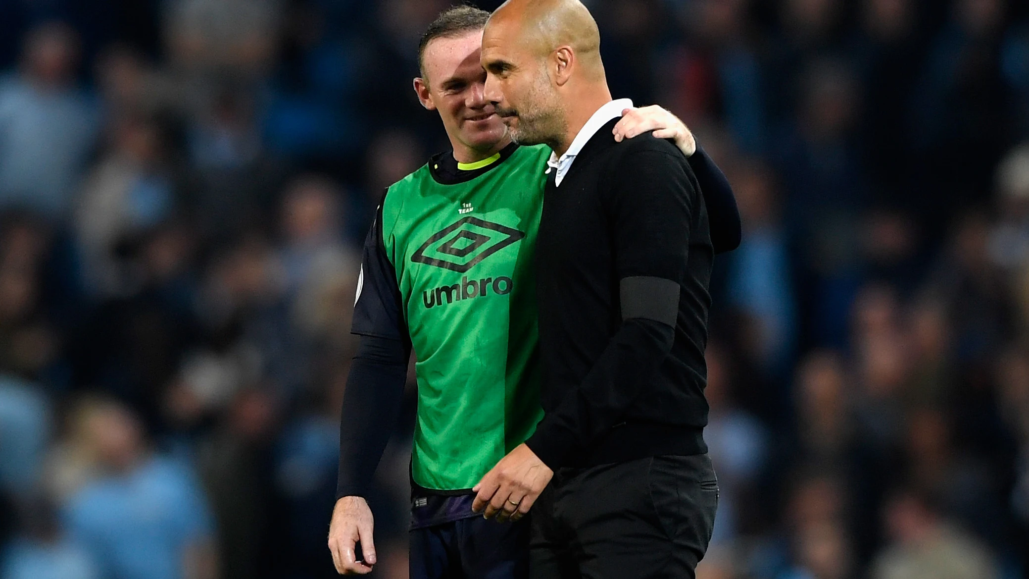 Wayne Rooney y Pep Guardiola