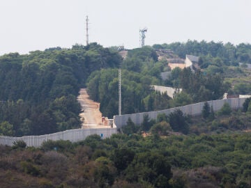 Israel and Hezbollah exchange more than a dozen missiles in an escalation of tension on the Lebanese border