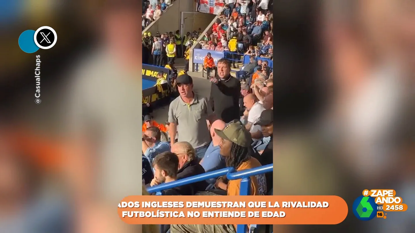 El divertido momento en el que un niño vuelve 'locos' a dos aficionados rivales durante un partido El divertido momento en el que un niño vuelve 'locos' a dos aficionados rivales durante un partido