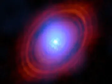 Vapor de agua en tonos azules en el disco que rodea la estrella HL Tauri Vapor de agua en tonos azules en el disco que rodea la estrella HL Tauri
