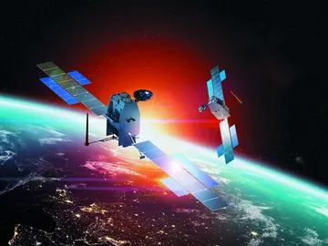 Imagen de archivo de un satélite orbitando alrededor de la Tierra Imagen de archivo de un satélite orbitando alrededor de la Tierra