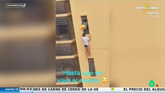 Un amante se cuelga de la ventana de un edificio de 20 pisos para no ser pillado por el marido y el vecino lo graba Un amante se cuelga de la ventana de un edificio de 20 pisos para no ser pillado por el marido y el vecino lo graba