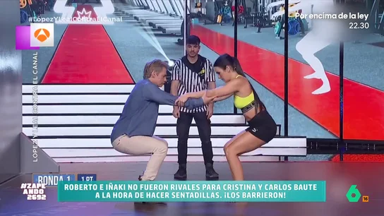 Cristina Pedroche se enfrenta a Roberto Leal e Iñaki López: "Se juntaron cuatro nalgas de acero" La zapeadora, junto con Carlos Baute, demuestran su capacidad física enfrentándose al reto de hacer una sentadilla conjunta. ¿Serán capaces de superar a Roberto e Iñaki? Descúbrelo en el vídeo principal.