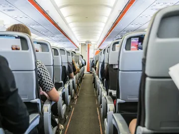 Pasajeros en un avión Pasajeros en un avión